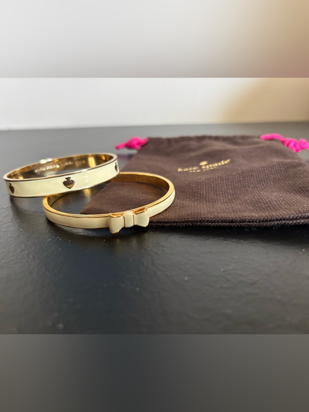 kate spade Cream Enamel Bow and Heart Bangle Set with Gold Trim with bag